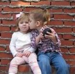 picture of little kid kissing another little kid